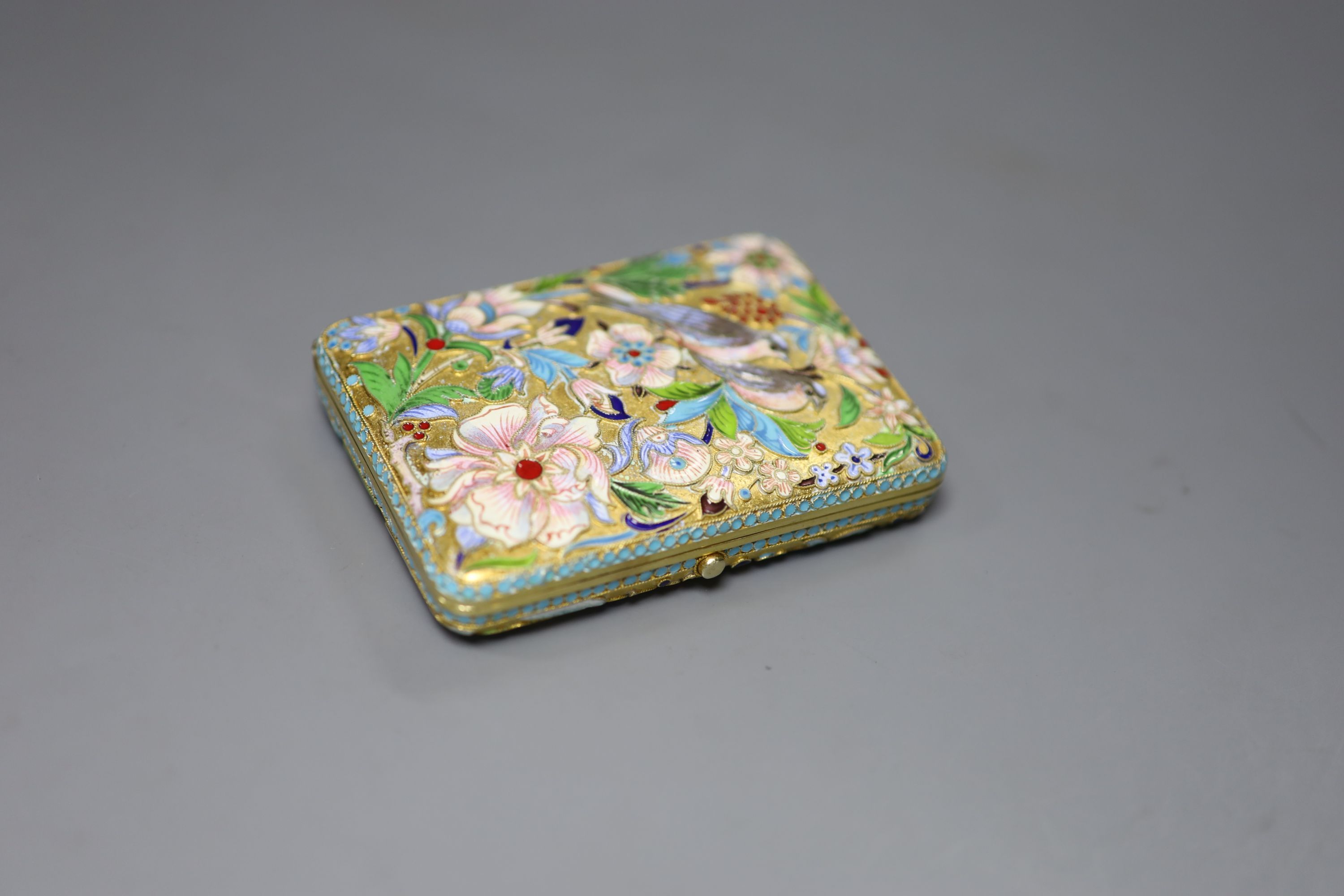 A modern Russian style gilt white metal and cloisonne enamel cigarette case, 93mm, gross 5oz.